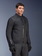 Alpinestars Andes Air Drystar® Jacket waterproof membrane, Black, worn by a male model with black gloves and pants, lightweight technical textile with 'Drystar' branding on the sleeve, studio shot