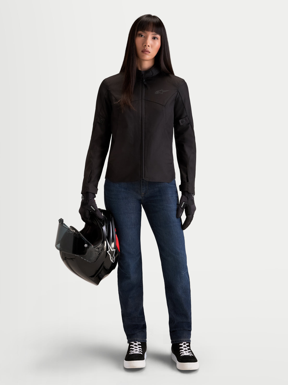 Alpinestars Stella C-1 Waterproof Jacket, women's urban motorcycle textile jacket in black, front view worn by a model holding a helmet