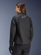 Alpinestars Stella Andes Air Drystar® Jacket, Women's Motorcycle Jacket, Black, rear view showing silver star logo, paired with black pants and gloves, lightweight waterproof touring gear