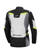 Alpinestars Stella ST-1 Waterproof Jacket, Back View, Women's Motorcycle Touring Jacket, Ice Gray, Black, and Yellow Fluo, features Alpinestars logo on lower back and upper neck, adventure touring design with protective textile construction and fluorescent accents.