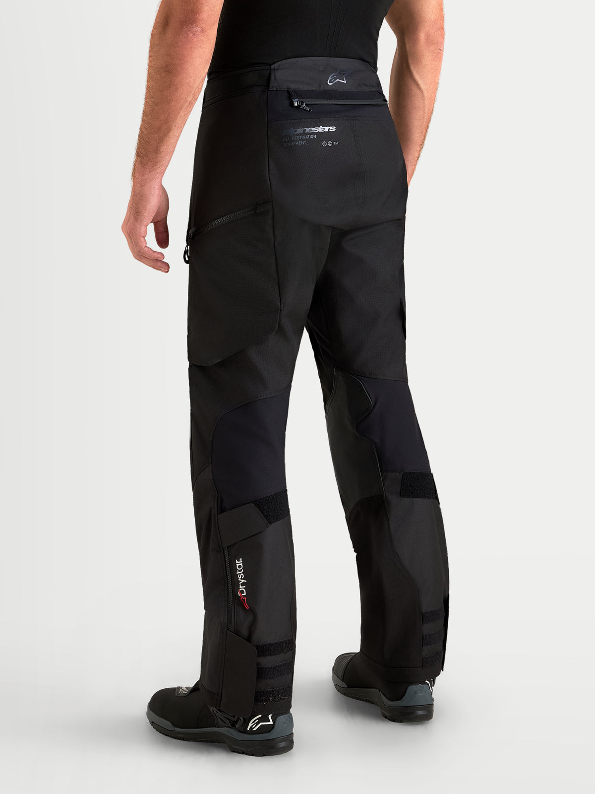 Alpinestars Harok V2 Drystar Pants, Men's Black adventure motorcycle pants, rear view showing durable ripstop construction, Drystar branding on lower leg, and over-the-boot design