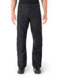 Alpinestars ST-1 Waterproof Pants, Black Motorcycle Touring Pants, front view featuring vertical zippered thigh pockets and adjustable waist tabs, worn with black red-soled boots, plain white background