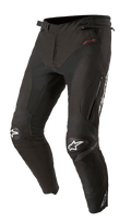 Alpinestars T-SP R Drystar Pants, Black Textile Motorcycle Sport-Touring Pants, featuring reinforced knee pads with white star logos, red Drystar branding on the hip, zippered thigh vents, and adjustable buckle waist, designed with an articulated race-inspired fit.