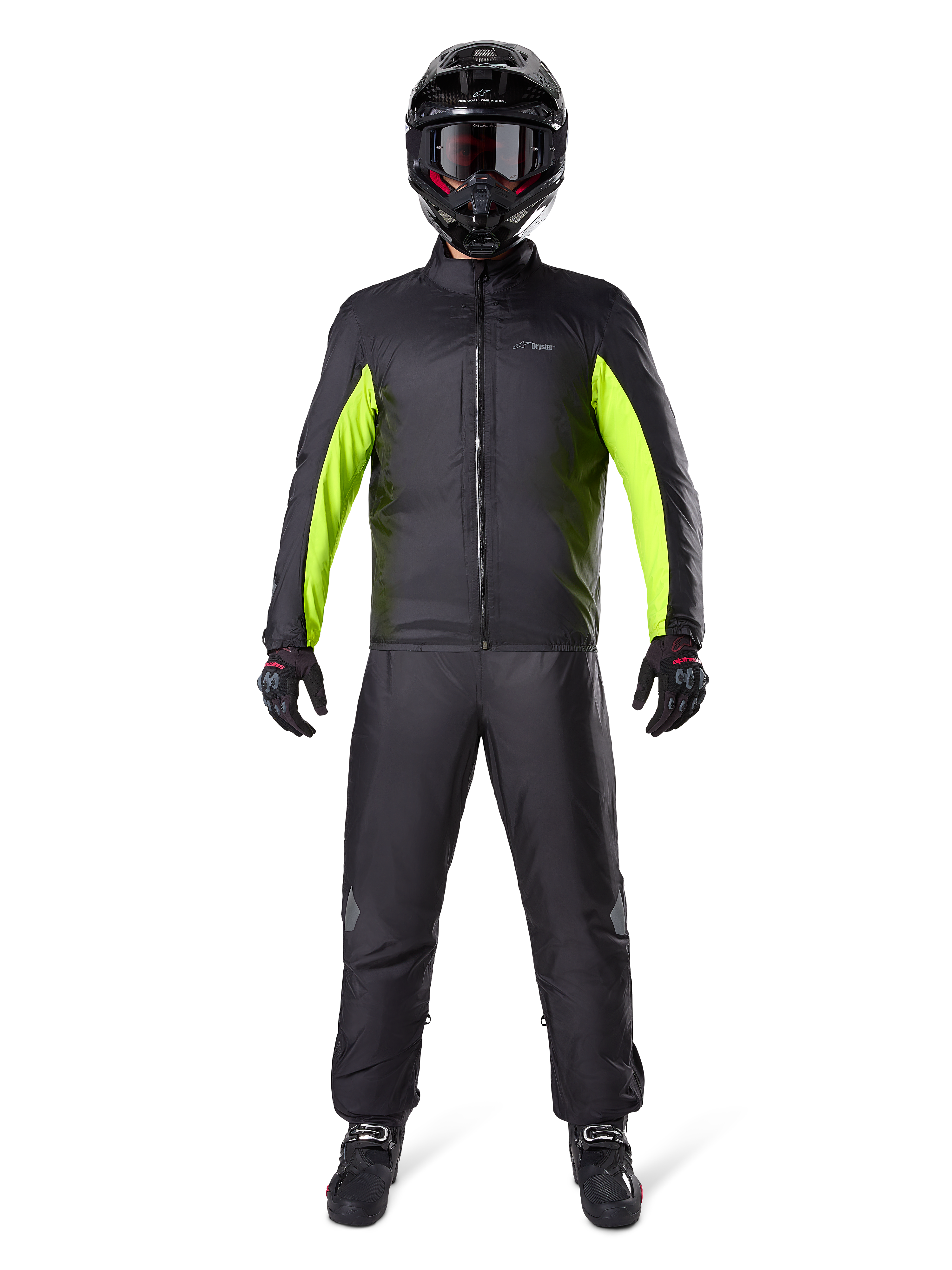 Alpinestars Bogota Pro Drystar 3 Seasons Pants, Black, worn by a motorcycle rider in a full adventure outfit including a black and neon yellow waterproof jacket, black helmet, and riding boots, designed for all-weather touring performance.