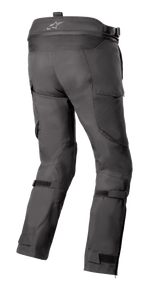 Alpinestars Bogota' Pro Drystar® 4 Seasons Pants, Black, Rear view of adventure touring motorcycle pants showing logo on the waistband, accordion stretch panels, and adjustable leg straps