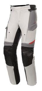 Alpinestars Andes V3 Drystar® Pants, Motorcycle Adventure Touring Pants, Ice Gray and Dark Gray with black accents, featuring reinforced knee panels, cargo-style pockets, and adjustable waist strap, durable textile material with red details