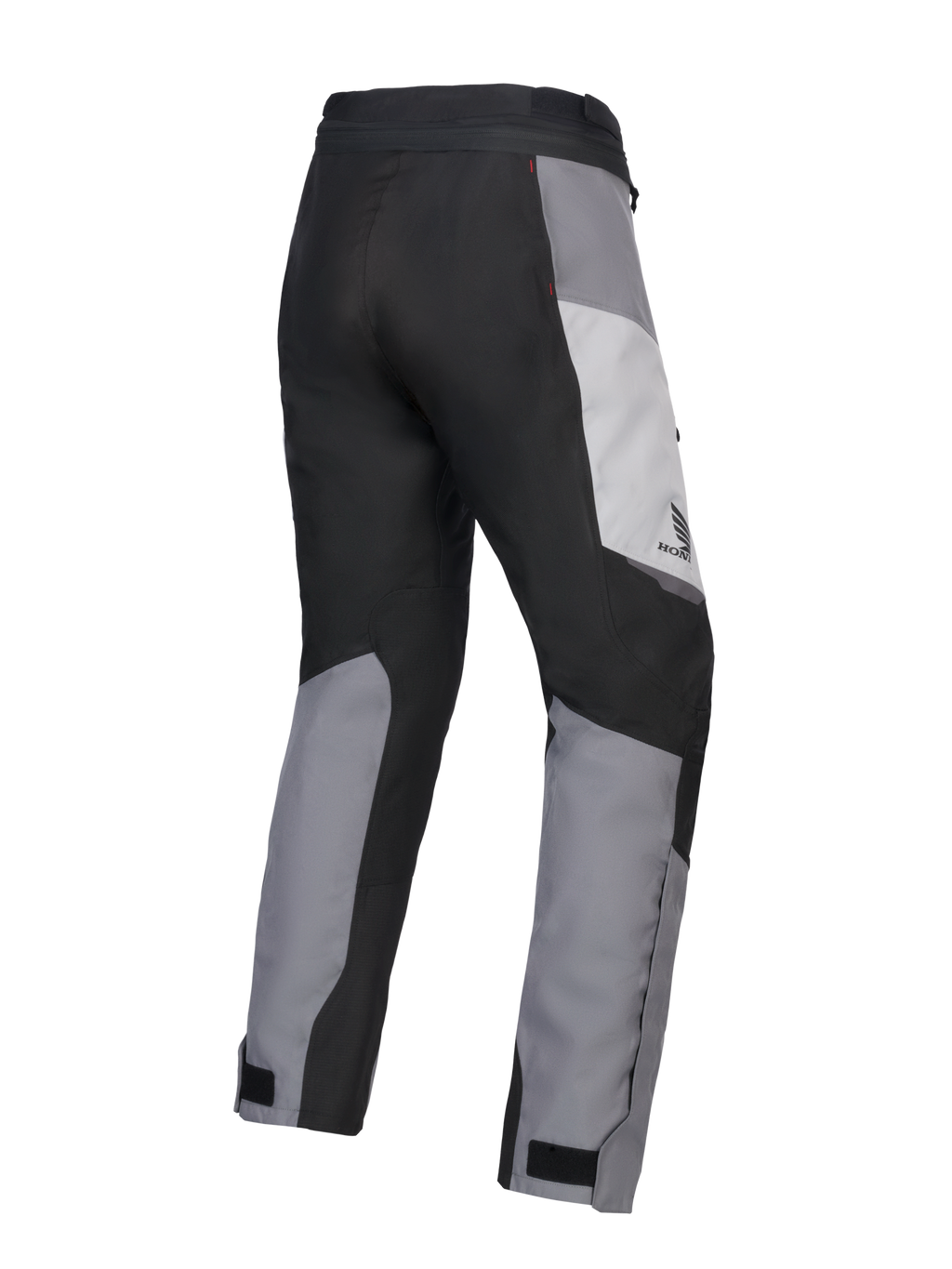 Alpinestars 2025 Honda Stella ST-1 Waterproof Damen-Motorradhose, Damen-Motorrad-Touringhose, Ice Gray, Dunkelgrau und Schwarz, Rückansicht in Dreiviertel-Perspektive zeigt strapazierfähige Textilkonstruktion, grau und schwarz farblich abgesetzte Paneele, Honda-Branding an der Hüfte und verstellbare Knöchelverschlüsse.
