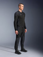 Alpinestars Troop-Air Pro Jacket, technical armored air jacket, Black, worn by model with matching black motorcycle pants and boots, featuring advanced 2D tech mesh structure and breathable ventilation panels, urban contemporary riding gear.