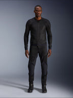 Male model wearing the Alpinestars Troop-Air Jacket in Black Black, lightweight mesh motorcycle jacket, paired with matching black riding pants and boots, featuring a technical 2D tech mesh construction for superior airflow.