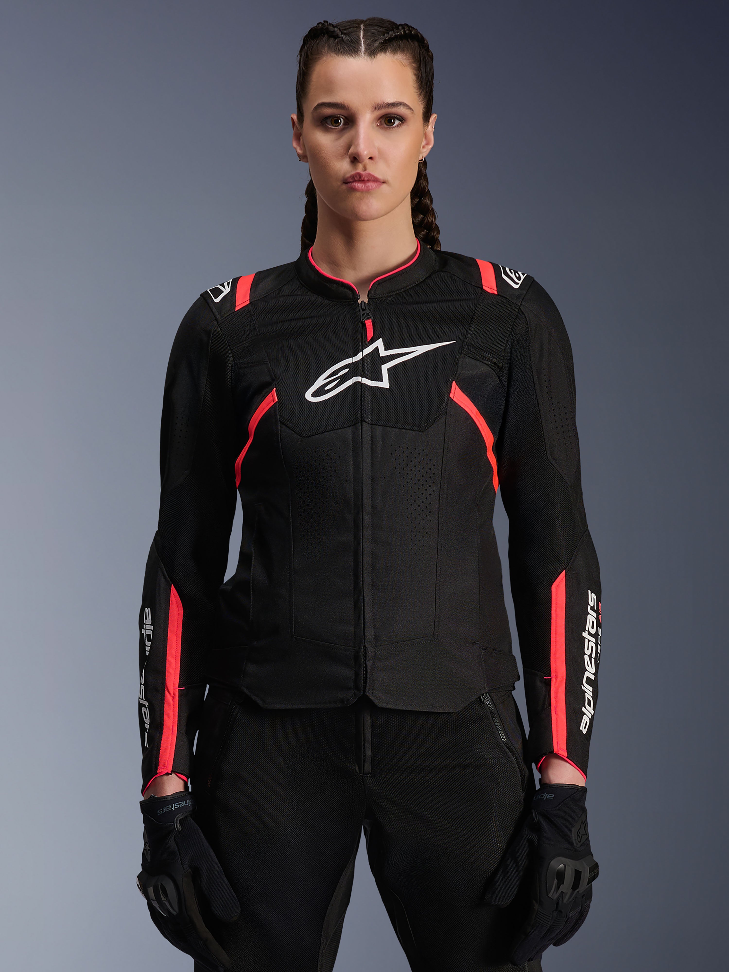 Alpinestars Stella T-SPS Air V2 Jacket, Women's Motorcycle Jacket, Black and Diva Pink, ventilated textile construction with white logo, pink racing-inspired accents on shoulders and sleeves, worn by a female model