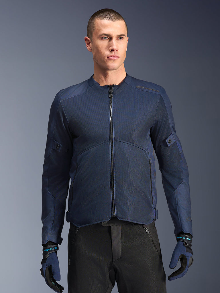 Alpinestars C-1 Air Jacket, Blue motorcycle jacket, worn by a male model with black pants and matching blue and black gloves, featuring tech mesh panels for airflow, clean urban design with front zipper and subtle branding