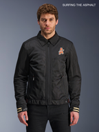Alpinestars Ignite Air Jacket, men's urban motorcycle textile jacket in black, front view worn by a model featuring a traditional shirt collar, club-inspired chest graphics, and CE certified construction.