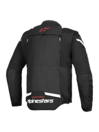 Alpinestars T-Stunt Air Jacke, Rückansicht, Schwarz und Weiß, mit einem roten Stern-Logo am Nacken, weißem Branding am unteren Rücken und vertikalen Reißverschlüssen für das modulare Airflow-System.