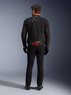 Alpinestars SMX Air Jacket, Black with Bright Red logo, Rear view showing Tech-Air Ready branding and mesh ventilation panels, worn with black pants and gloves, high-performance sport and racing motorcycle gear