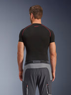 Alpinestars Maxdura Dual Pants, Adventure Motorcycle Pants, Dark Gray and Deep Gray, rear view showing reinforced panels on the seat and waist, worn with a black short-sleeve base layer, featuring zippered pockets with red details