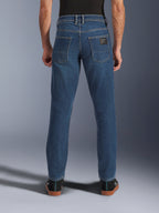 Alpinestars Flex-AST 5 Denim Pants, Urban Motorcycle Denim, Indigo Washed blue, rear view showing tapered fit and back pockets with branding patch, casual street styling
