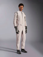 Alpinestars GP Race V3 Suit FIA, Silver Anthracite racing suit, one-piece driver suit with shoulder epaulettes and a belted waist, worn with matching black and white racing gloves and boots, sleek design for professional auto racing