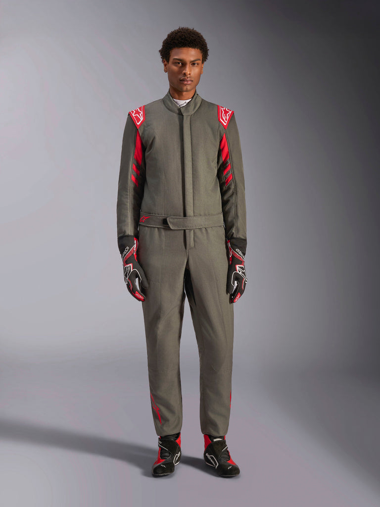 Alpinestars GP Race V3 Suit FIA, Auto Racing Suit, Anthracite Red, worn by a male model with matching gloves and boots, featuring red shoulder epaulettes and branding, professional motorsport gear for performance driving.