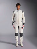 Alpinestars Hypertech V3 Suit, Professional Auto Racing Suit, White Black and Silver, worn by model with red and white gloves and matching white racing shoes, featuring black contrast panels and Alpinestars logos, athletic slim fit design