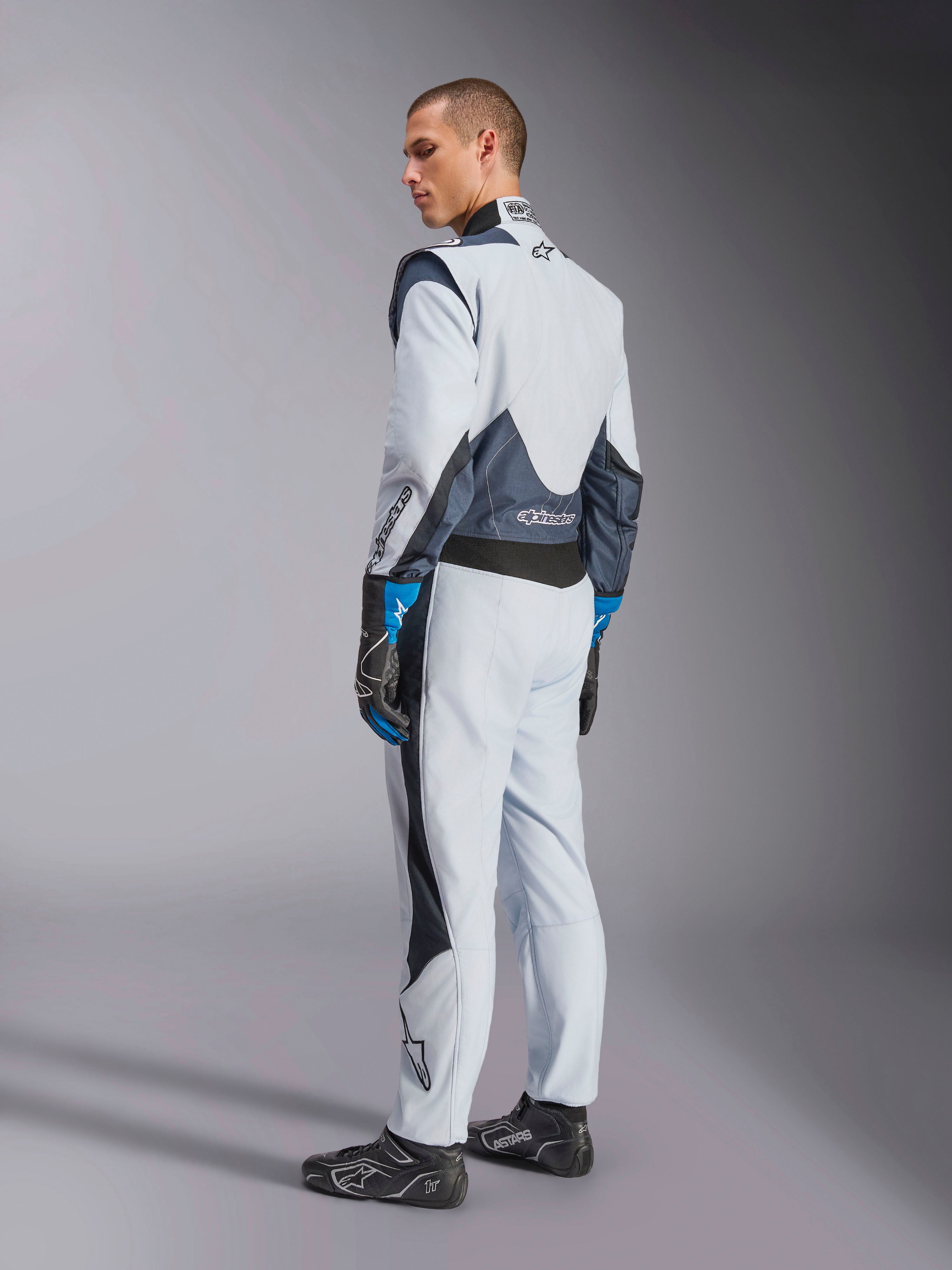 Alpinestars GP Pro Comp V2 FIA Suit in Silver and Blue, Men’s Auto Racing gear with rear stretch panels.