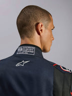 Alpinestars GP Tech V4 Suit in Blue Navy Black Red, close-up of the back collar featuring the FIA 8856-2018 certification label and white embroidered Alpinestars logo, high-performance auto racing suit detail