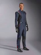 Alpinestars GP Tech V4 Suit, One-piece Auto Racing Suit, Blue Navy Black and Red, worn by a model with black racing gloves and boots, featuring black panels and red piping, professional motorsport gear.