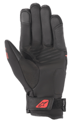 Alpinestars Syncro V2 Drystar® Handschuhe, Schwarz und Fluo-Rot, Handflächenansicht mit Konstruktion aus synthetischem Wildleder, gepolsterte Handfläche für Schutz, verstellbarer Handgelenkverschluss mit rotem Logo, Drystar®-Branding.