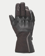 Alpinestars Stella Tourer W-7 Drystar® Damen-Handschuhe, Schwarz, Winter-Motorradhandschuhe im Stulpen-Stil aus Leder und Softshell, mit lederüberzogenem Hartschalen-Knöchelschutz, reflektierenden silbernen Akzenten und Alpinestars-Logo auf dem Finger.