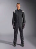 Alpinestars Kart Indoor V2 Suit, One-piece Karting Suit, Black, featuring white Astars logos on the shoulders and lower legs, adjustable waist belt and ergonomic collar, designed for recreational indoor karting