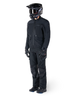 Motorcyclist wearing the Alpinestars St-7 Prime GORE-TEX Jacket in black, coordinated adventure touring outfit with matching black pants, black helmet with goggles, and gloves, featuring a streamlined and functional design for all-weather performance.