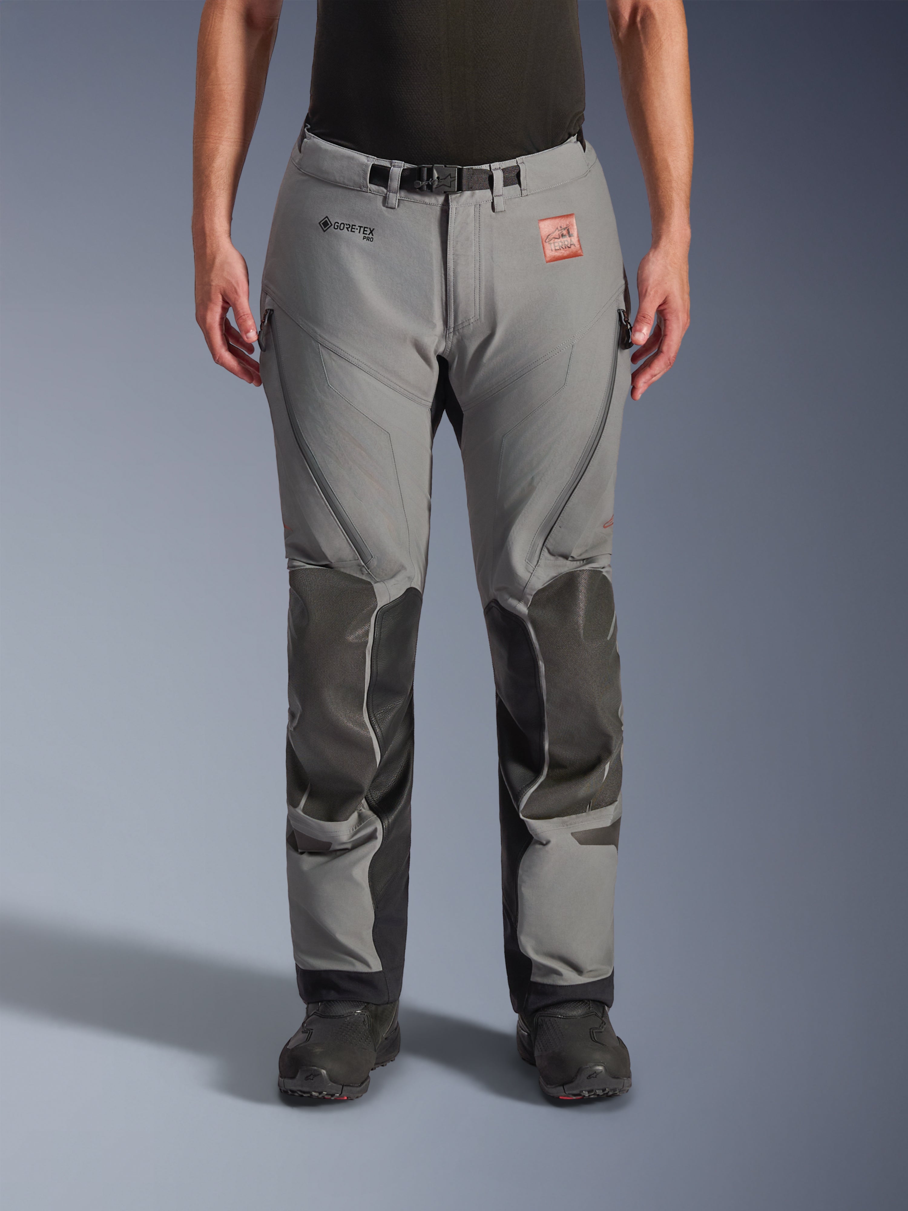 Alpinestars Nazca 3L GORE-TEX PRO Pants, Gray with black knee and shin reinforcements, technical adventure motorcycle riding pants, front view, featuring GORE-TEX branding, zippered thigh vents, and adjustable waist belt