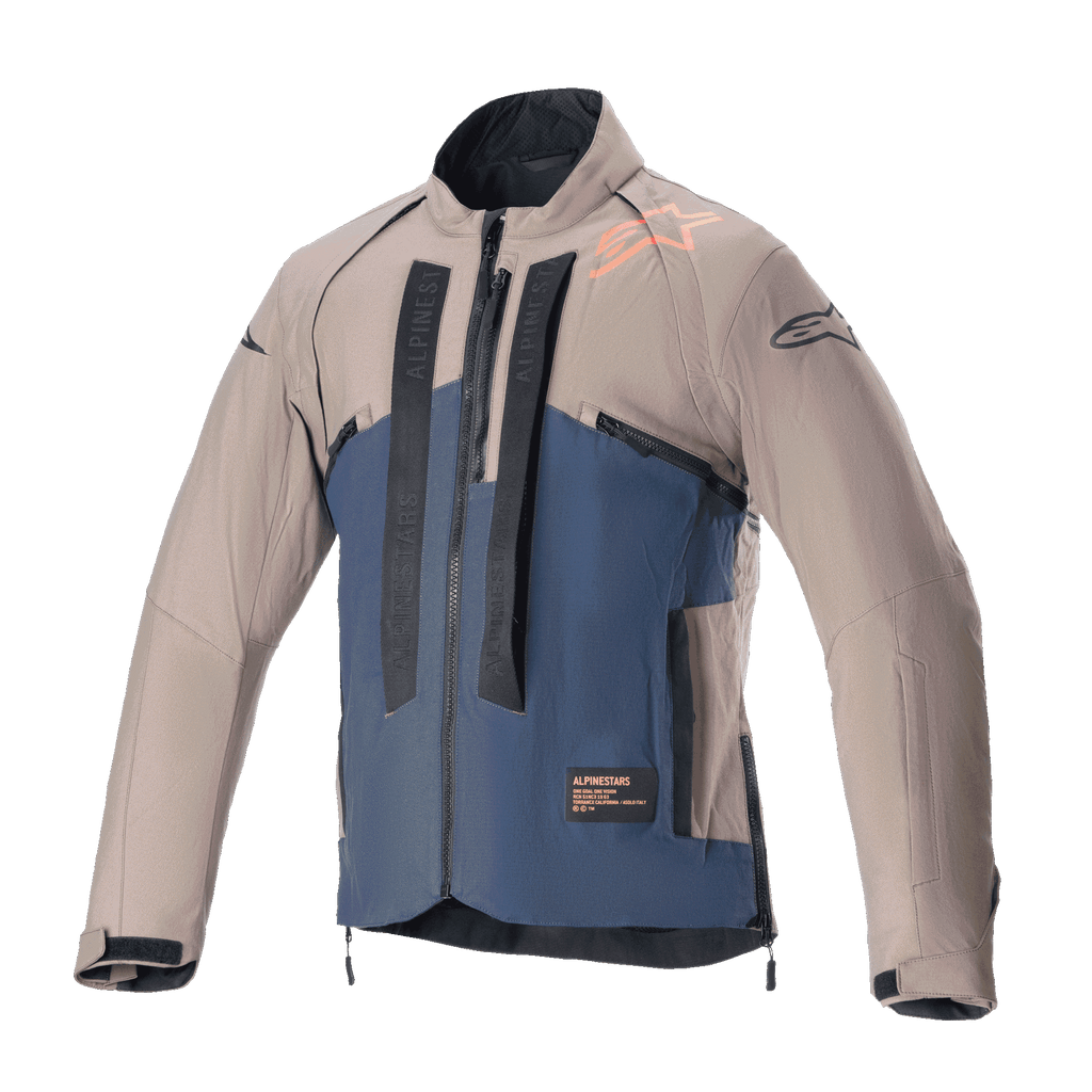 Alpinestars Techdura Jacke, Offroad-Motorradjacke, Falcon Brown und Night Navy, Vorderansicht, zweifarbige Konstruktion mit vertikalem schwarzem Alpinestars-Branding, orangem Schulter-Logo, hohem Kragen und Front-Reißverschluss, technische Bekleidung für Enduro- und Adventure-Fahrten.