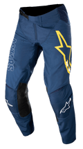 Alpinestars Techstar Phantom Hose, Motocross-Hose, Dunkelblau mit gelben und weißen Akzenten, schwarze Knieeinsätze aus Leder, großes gelbes Stern-Logo am Oberschenkel, weißes ASTARS-Branding, strapazierfähiges Stretch-Ripstop-Gewebe für Offroad-Rennsport