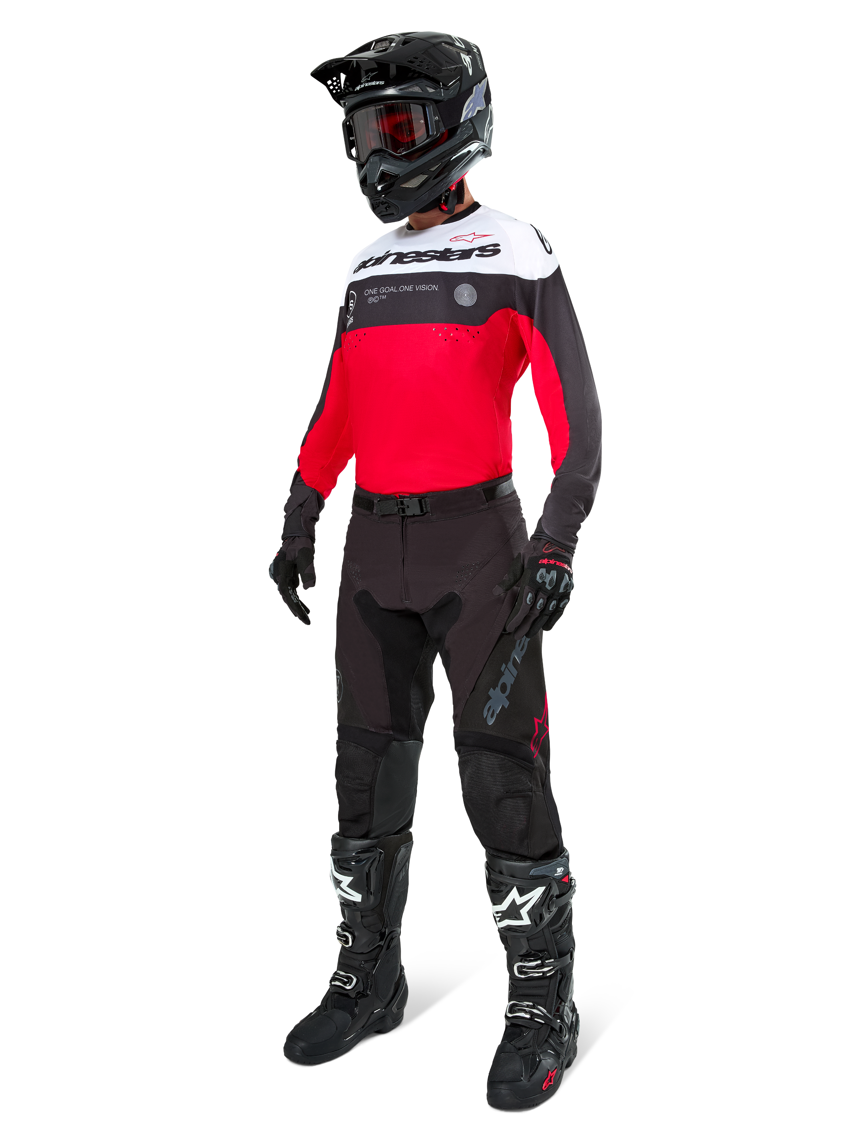 Alpinestars Pro-Dura Hose in Black Magnet White, getragen von einem Fahrer mit passendem rot-schwarz-weißem Trikot, schwarzem Helm und schwarzen Offroad-Stiefeln, komplettes professionelles Enduro-Rennsport-Ausrüstungsset für Offroad-Performance.