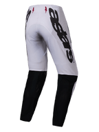 Alpinestars 2025 Supertech Maker Pants, Motocross Pants, Silver and Black, rear view featuring large black Alpinestars branding on the side, black lower leg panels, and small red star logos on the waistband, designed for professional off-road performance.