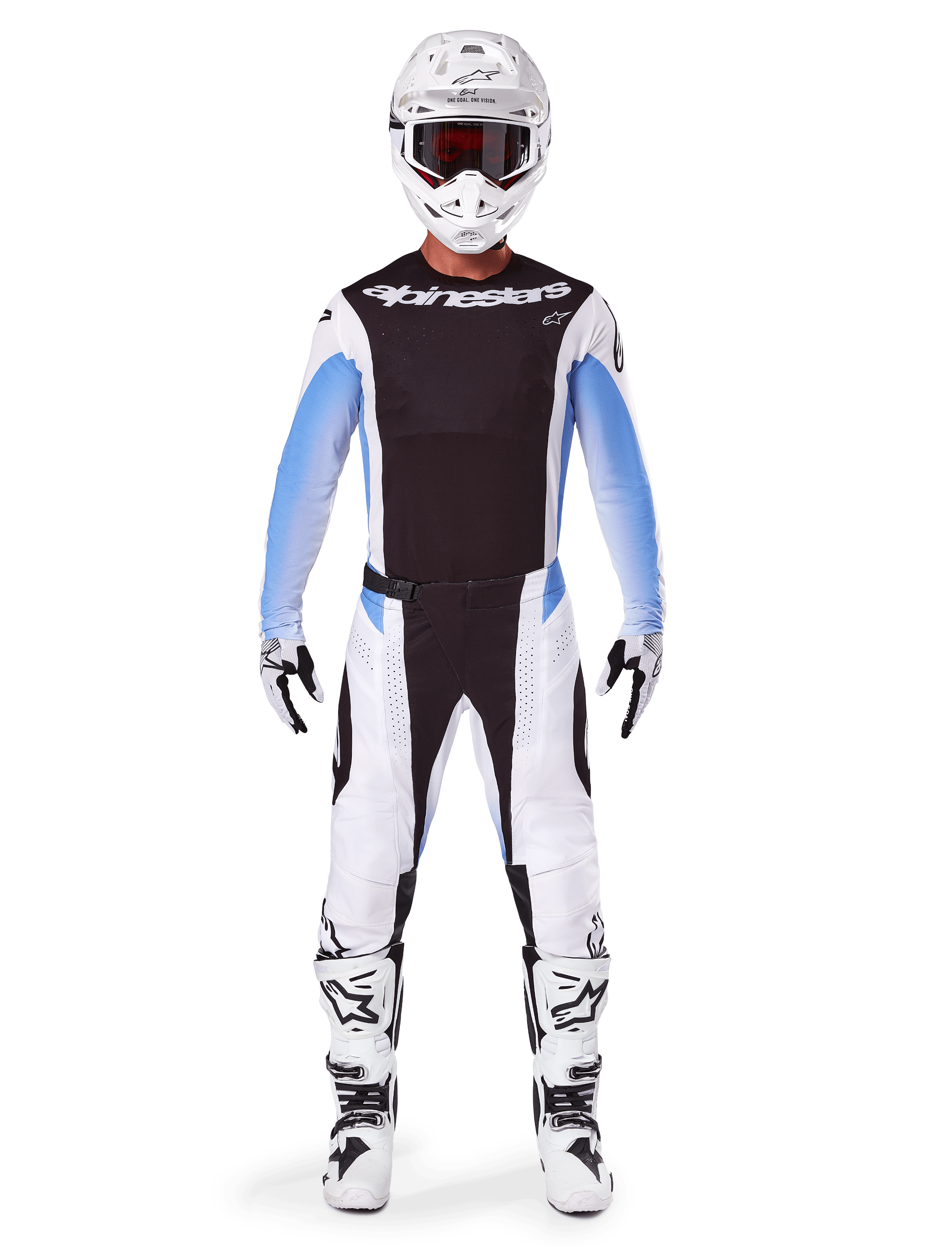 Motocross-Fahrer in Alpinestars 2025 Techstar Melt Hose, Motocross-Hose, Schwarz und Blau, weiß-schwarzes Multi-Panel-Design mit blauen Hüftakzenten, getragen mit passendem weißem Trikot, weißem Helm, weißen Handschuhen und Stiefeln für eine komplette Offroad-Rennausrüstung