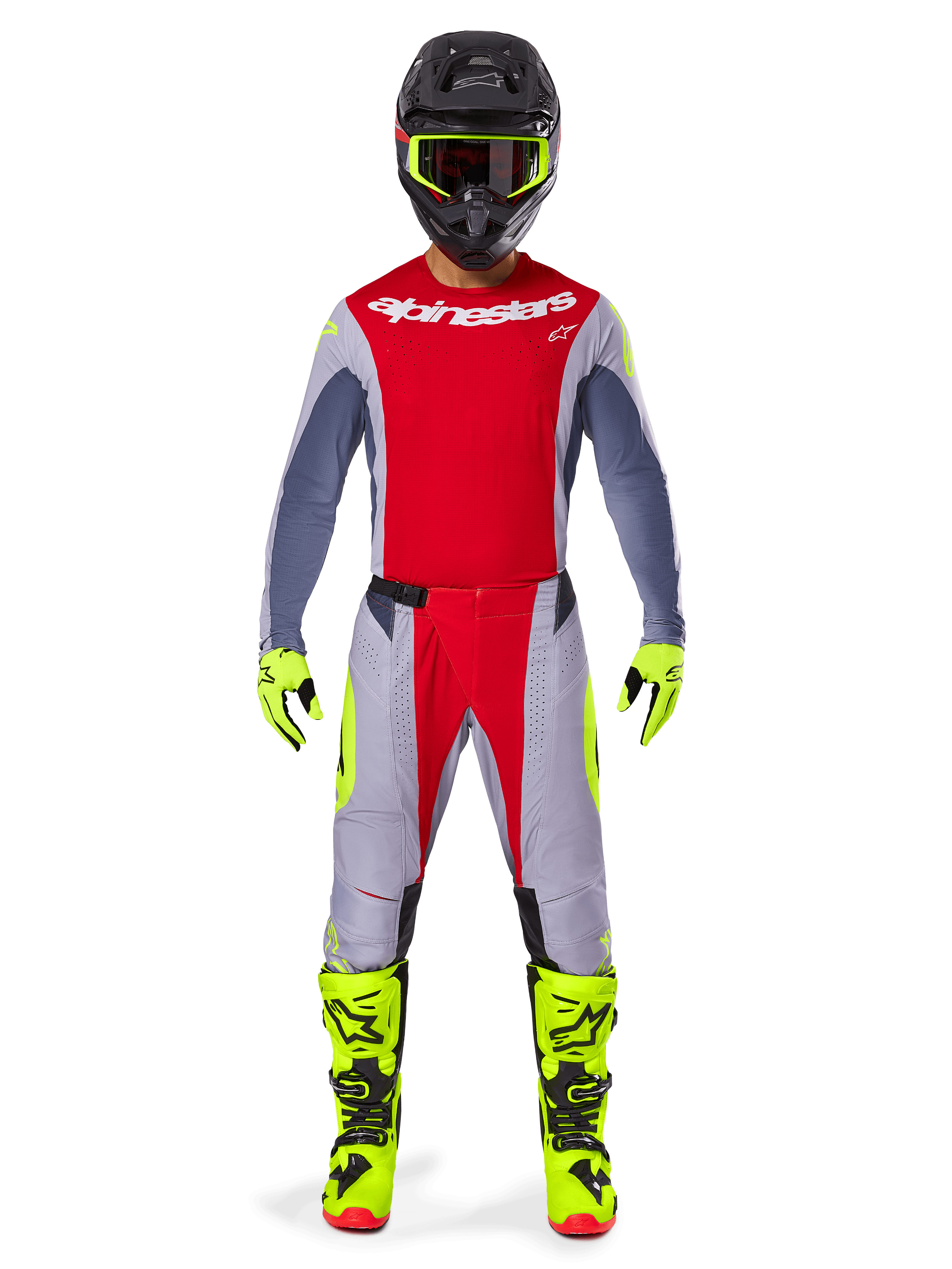 Motocross-Fahrer mit Alpinestars 2025 Techstar Melt Hose in Hellrot und Grau, mit leuchtend roten Einsätzen und neongelben Akzenten, kombiniert mit passendem Trikot, schwarzem Helm mit neongelber Brille sowie leuchtend gelben Stiefeln und Handschuhen, abgestimmtes Outfit für professionellen Motocross-Rennsport.