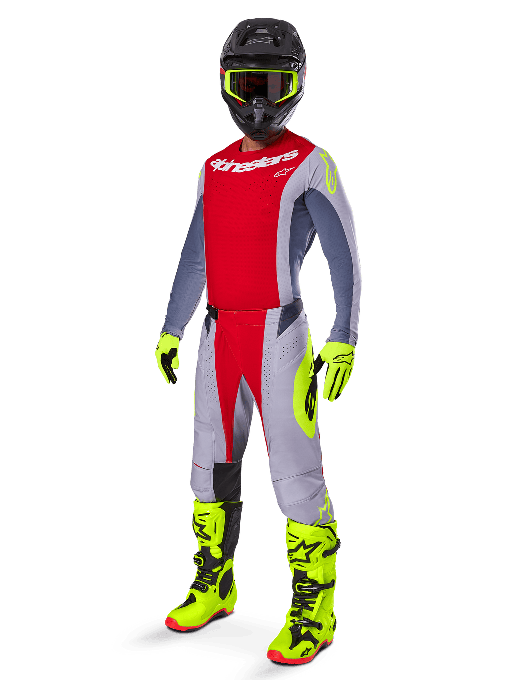 Motocross rider wearing the Alpinestars 2025 Techstar Melt Gear Set, red and gray jersey and pants, vibrant neon yellow gloves and boots, black helmet, complete off-road racing kit
