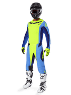 Alpinestars 2025 Techstar Melt Hose, Motocross-Hose, Gelb Fluo und Blau, getragen als Teil eines kompletten Rennausrüstungssets mit passendem Jersey, gelben und schwarzen Handschuhen, weiß-schwarzen Stiefeln und schwarzem Helm mit weißer Brille, abgestimmte Offroad-Performance-Ausrüstung.