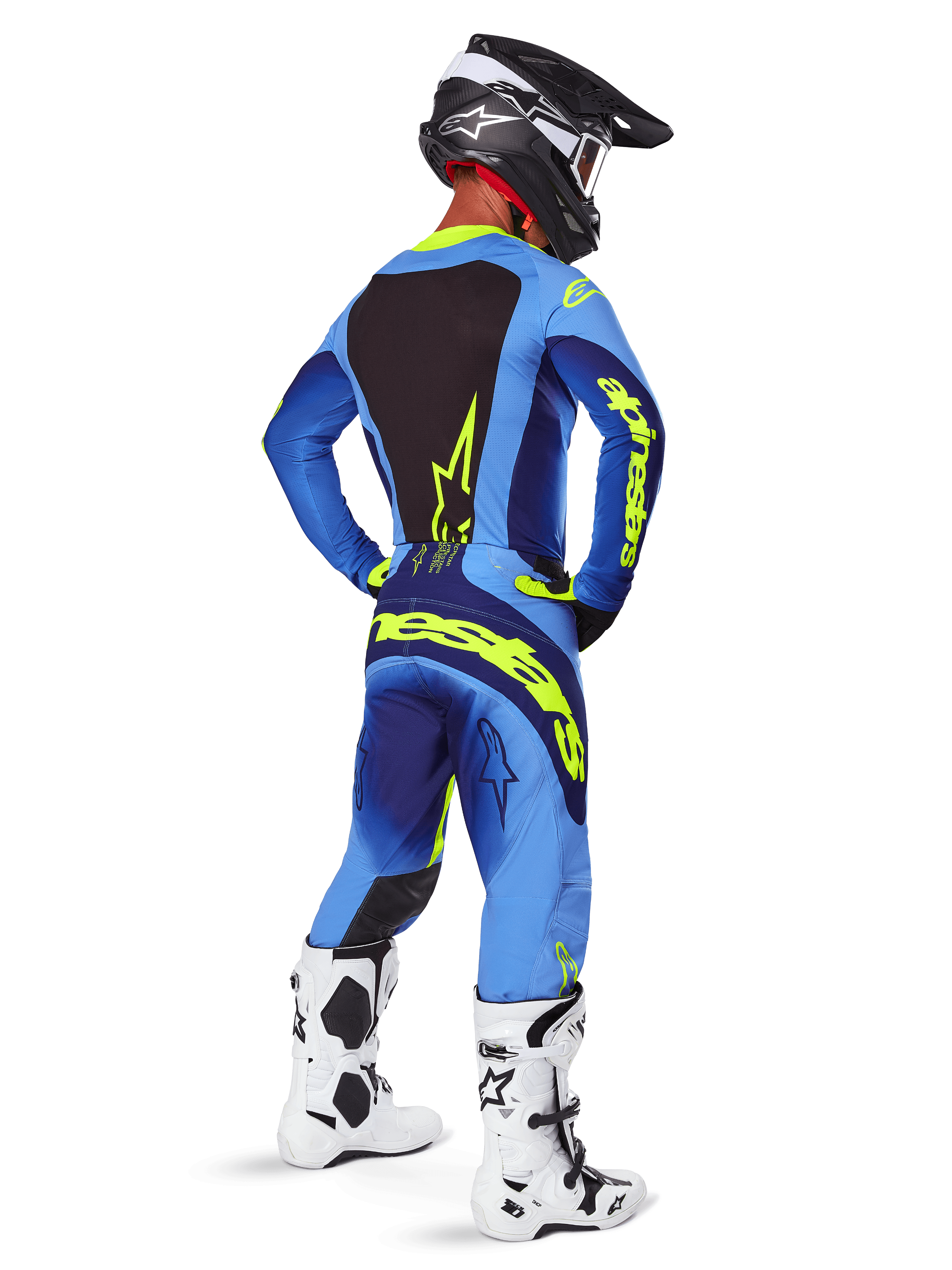Alpinestars 2025 Techstar Melt Hose, Motocross-Ausrüstung, Gelb Fluo Blau, Rückansicht eines Fahrers in passendem blauem Trikot mit großem gelbem Branding, weißen und schwarzen Stiefeln und schwarzem Helm, koordiniertes Rennoutfit für Offroad-Performance
