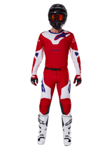 Alpinestars 2025 Racer Veil Pants and complete motocross gear set, Bright Red and White with blue accents, featuring a matching jersey, black helmet with orange goggles, white and black boots, and red gloves, coordinated performance look for off-road racing