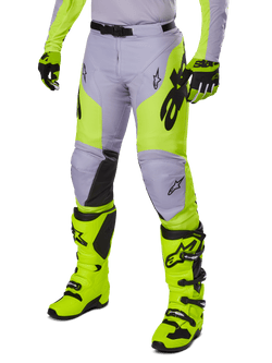Alpinestars 2025 Racer Veil Pants, Motocross Pants, Gray and Neon Yellow Fluo, featuring black star logos and adjustable waist belt, shown with matching motocross boots and gloves, ergonomic design for off-road riding