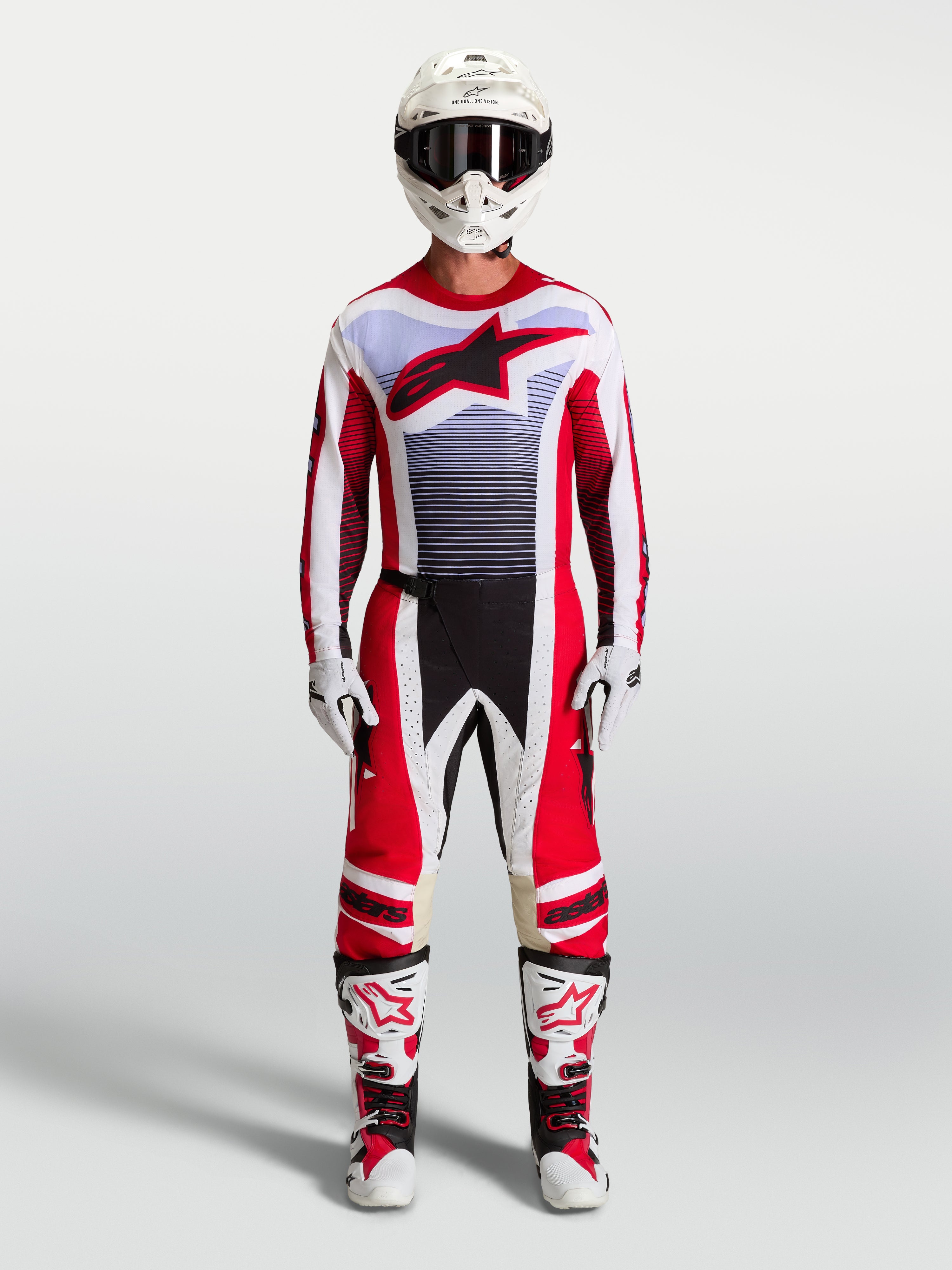 Alpinestars Techstar Maven Hose und Motocross-Set für Herren in Feuerrot und Weiß mit Lavendel-Akzenten und Stiefeln.