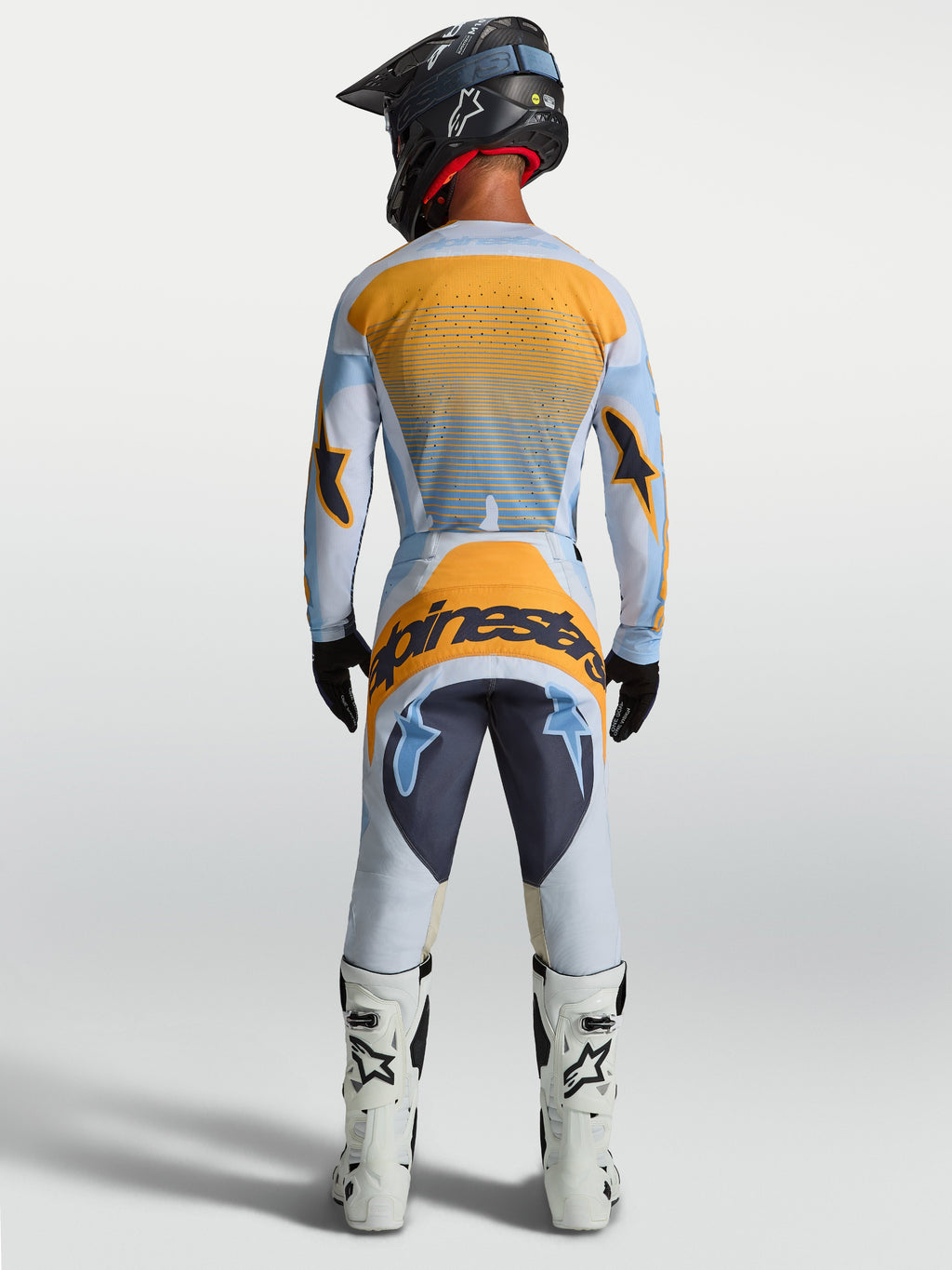 Alpinestars Techstar Maven Hose, Herren-Motocrosshose, Blau und Orange, Rückansicht mit ergonomischem Rennschnitt und verstärktem Sitzbereich.