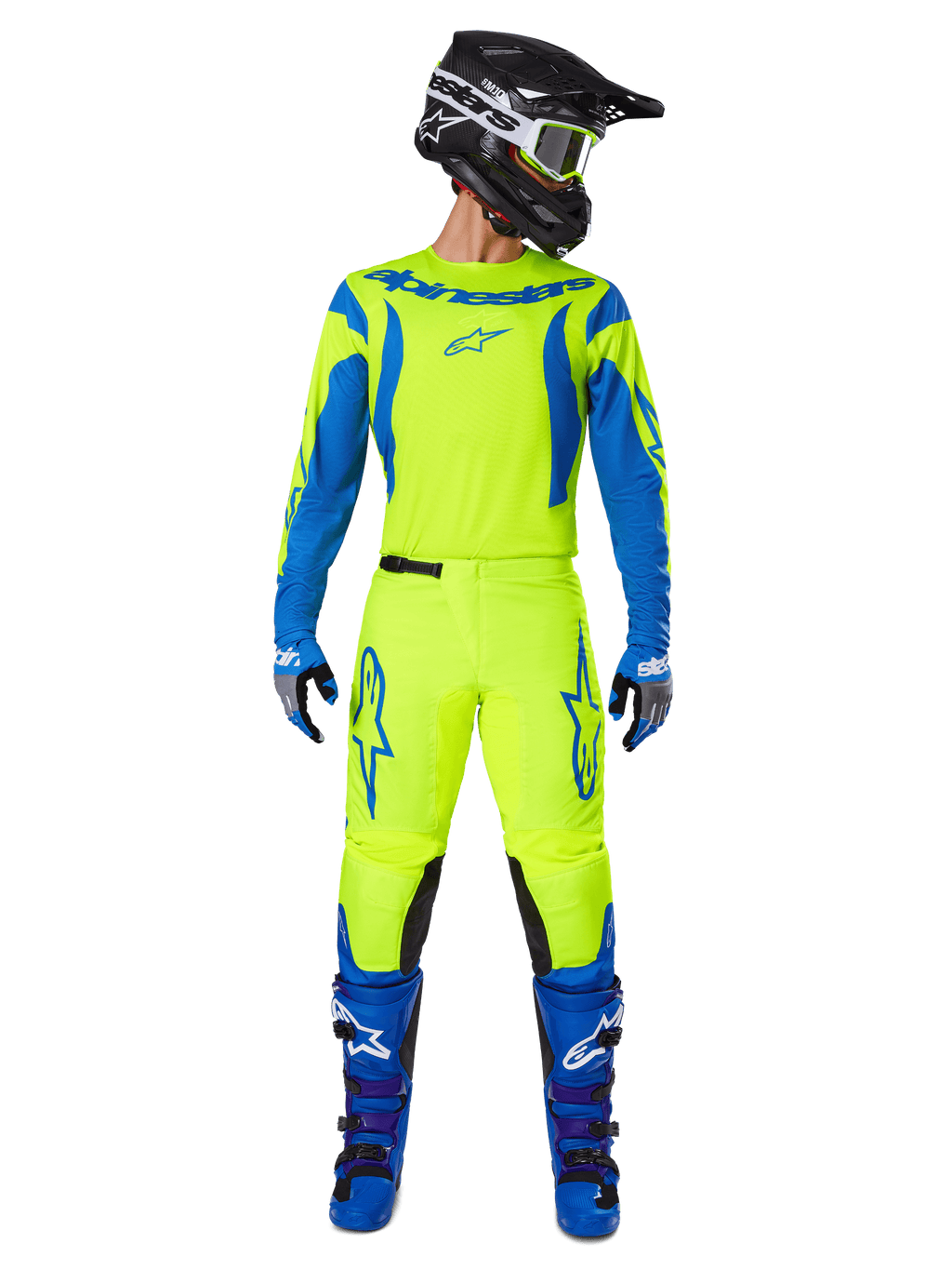 Alpinestars 2025 Fluid Haul Hose, Motocross-Hose, Neongelb und Blau, getragen als komplettes Racing-Kit mit passendem Trikot, blauen Stiefeln und schwarzem Helm, mit markantem blauen Branding an den Oberschenkeln und schwarzen Knieeinsätzen