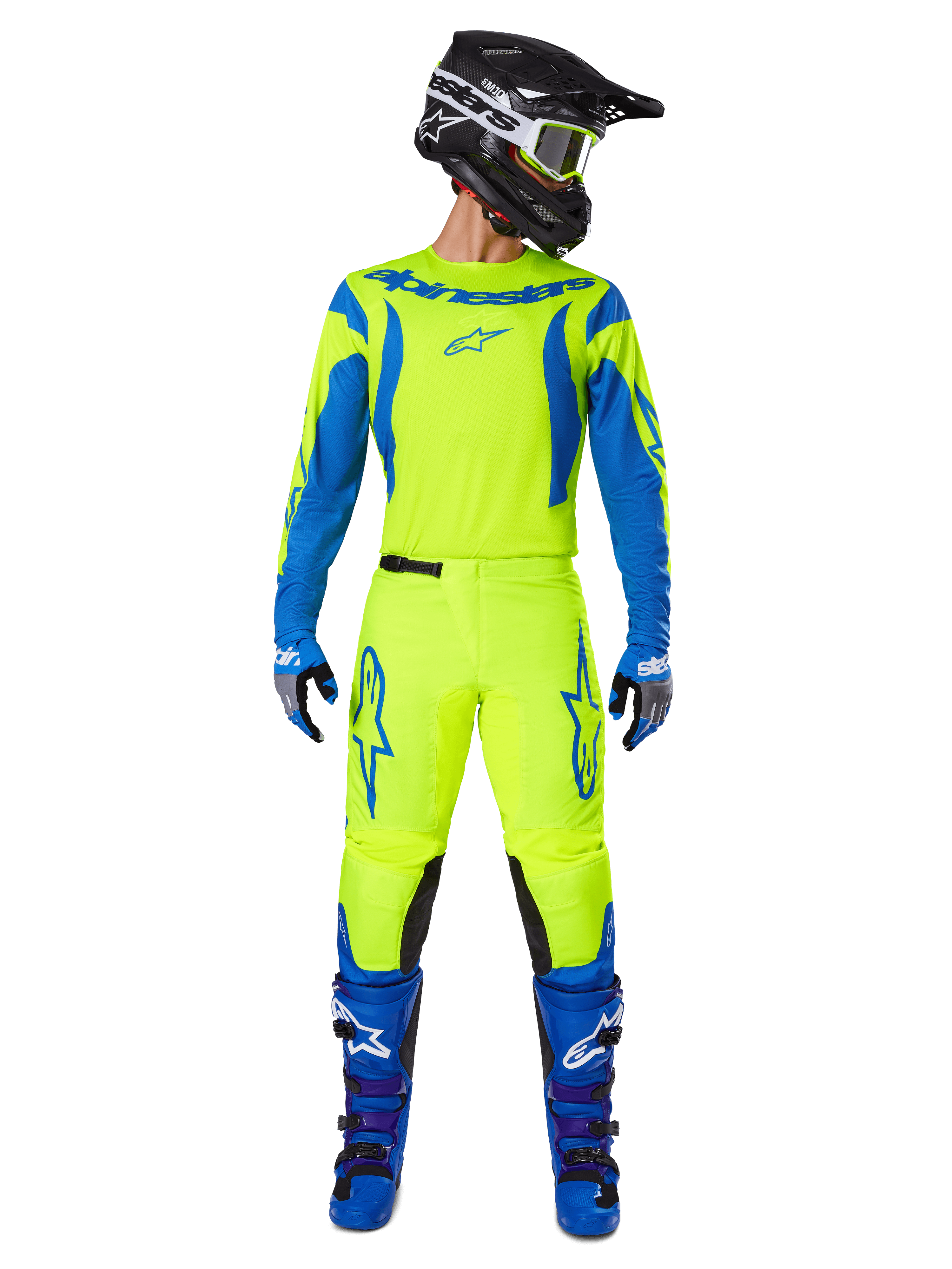 Alpinestars 2025 Fluid Haul Hose, Motocross-Hose, Neongelb und Blau, getragen als komplettes Racing-Kit mit passendem Trikot, blauen Stiefeln und schwarzem Helm, mit markantem blauen Branding an den Oberschenkeln und schwarzen Knieeinsätzen