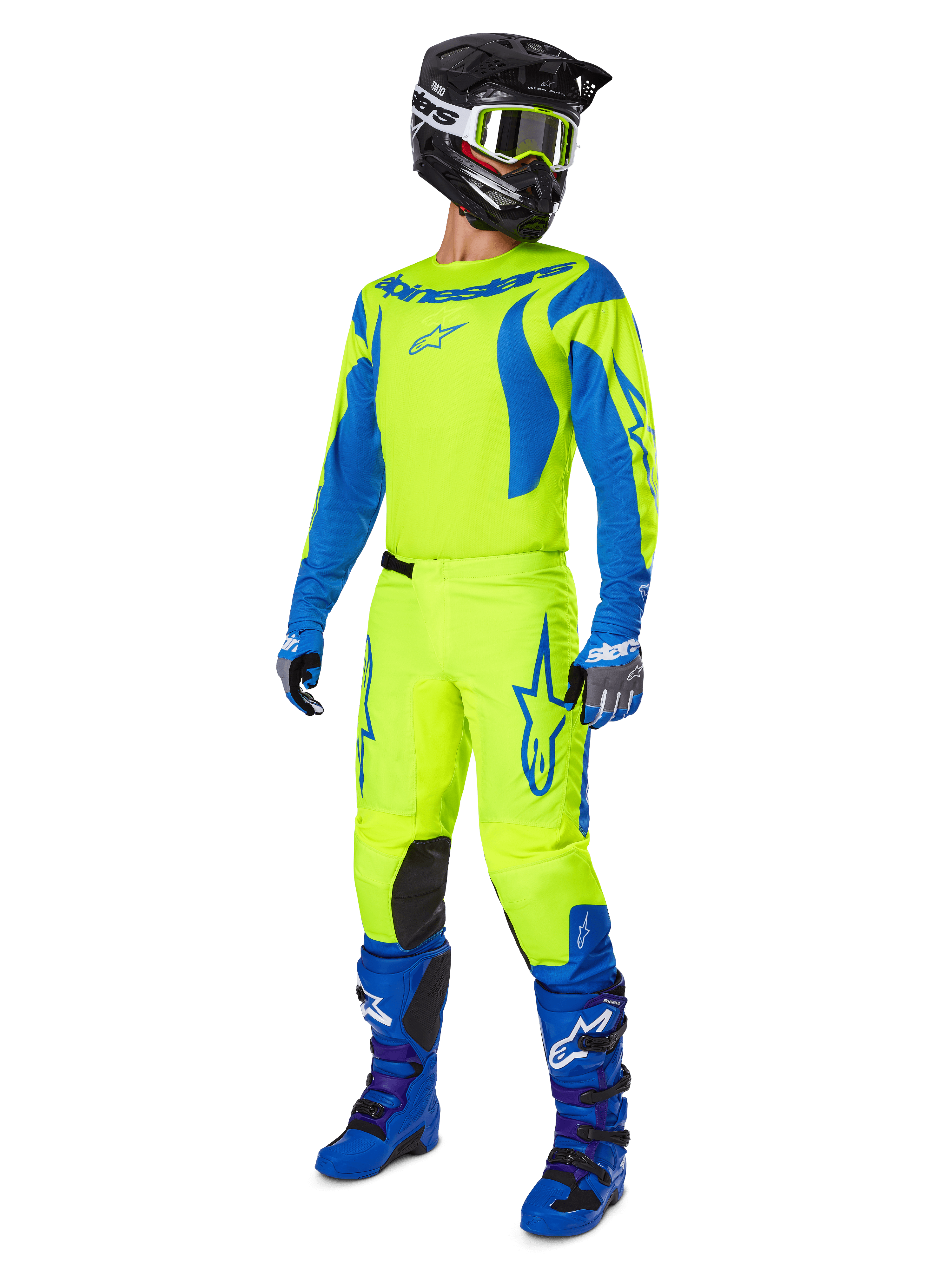 Alpinestars 2025 Fluid Haul Hose, Motocross-Hose, Leuchtendes Neongelb und Blau, getragen als Teil einer kompletten Rennausrüstung mit passendem Jersey, blauen Stiefeln und einem schwarzen Helm, High-Visibility-Design für das Offroad-Fahren.