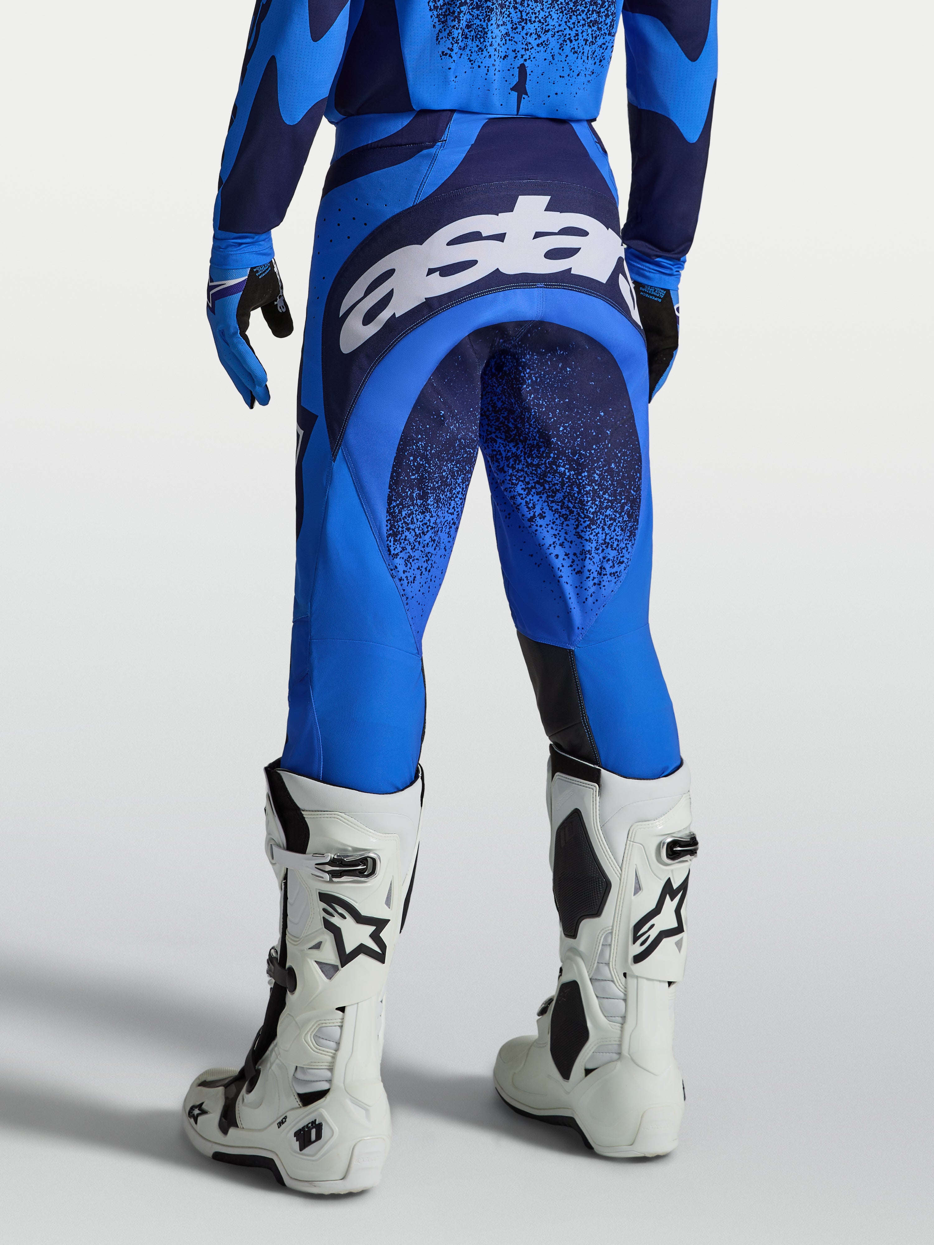Alpinestars Techstar Swan Pants, Motocross Racing Pants for Men, Ucla Blue and Deep Blue, with large white seat logo.