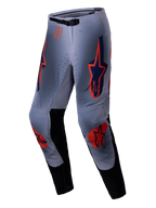 Alpinestars 2025 Supertech Lipan Pants, Motocross Pants, Gray and Orange Fluo, featuring vibrant orange and navy blue star logos on the thighs and knees, black inner leg panels, and an adjustable waist belt, designed for pro-level off-road performance.