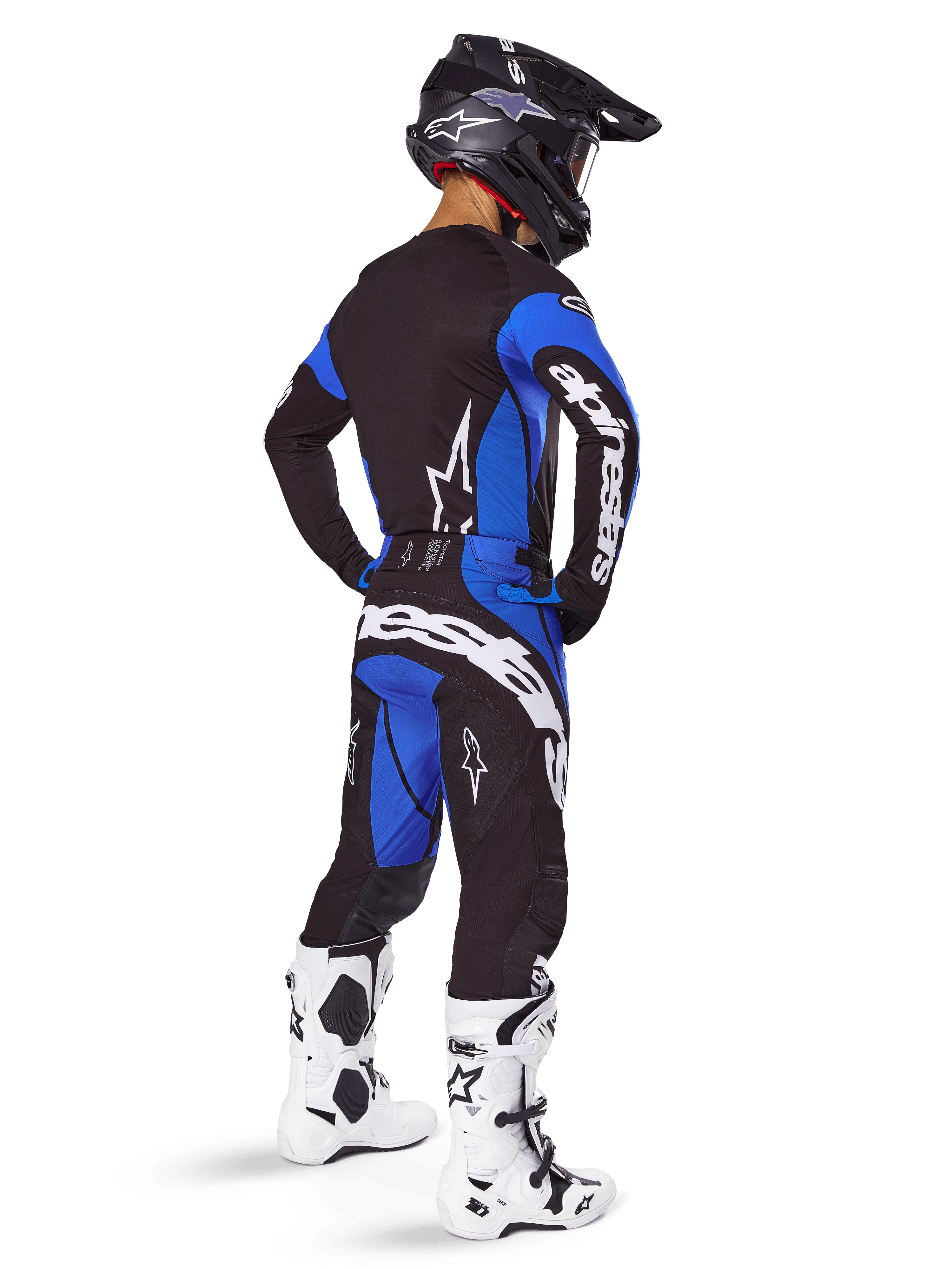 Alpinestars 2025 Techstar Dreem Pants, Motocross Pants, Black and Blue, worn by a rider in a full gear set including a matching jersey, black helmet, and white boots, featuring bold white branding on the rear and a performance-driven racing fit.